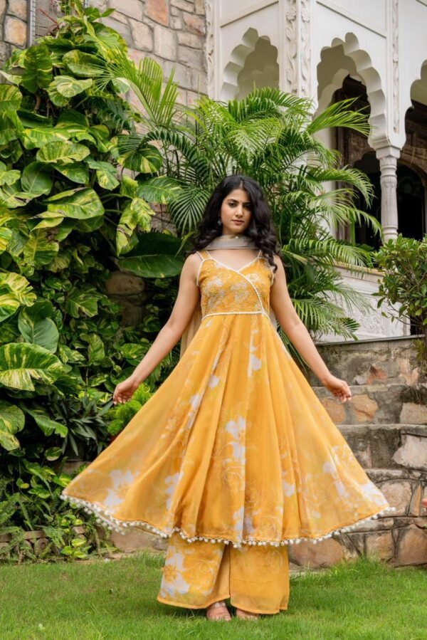 Yellow Popcorn Gotapatti Suit Set, also referred to as a Manjal Anarkali Suit Set.