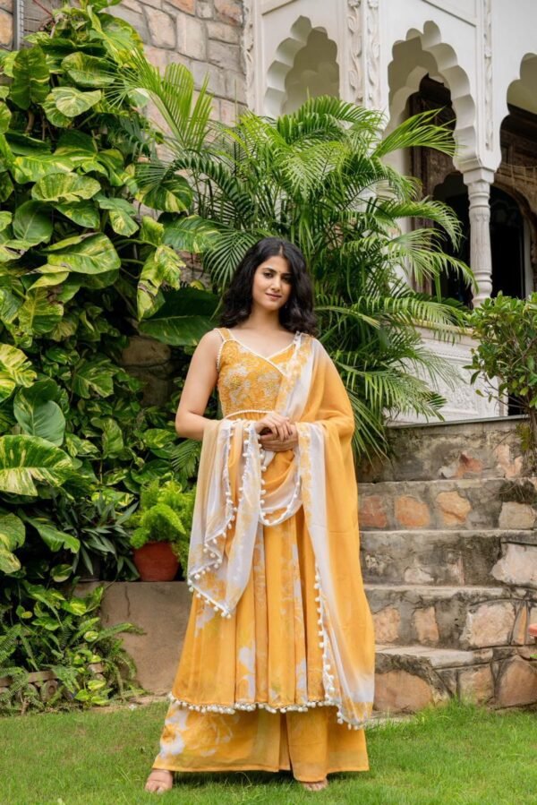 Yellow Popcorn Gotapatti Suit Set, also referred to as a Manjal Anarkali Suit Set